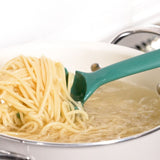 Teal spoon lifting spaghetti from a pot of boiling water