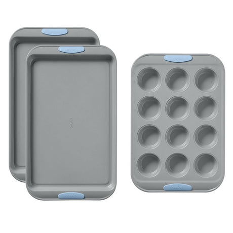 Set of gray baking trays with blue silicone grips on a white background
