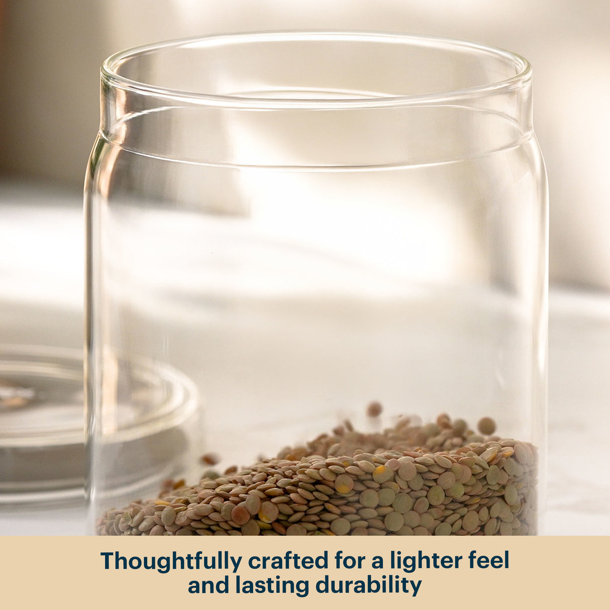 Clear glass jar with seeds inside on a neutral background