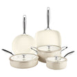 Set of ceramic cookware with glass lids on a white background