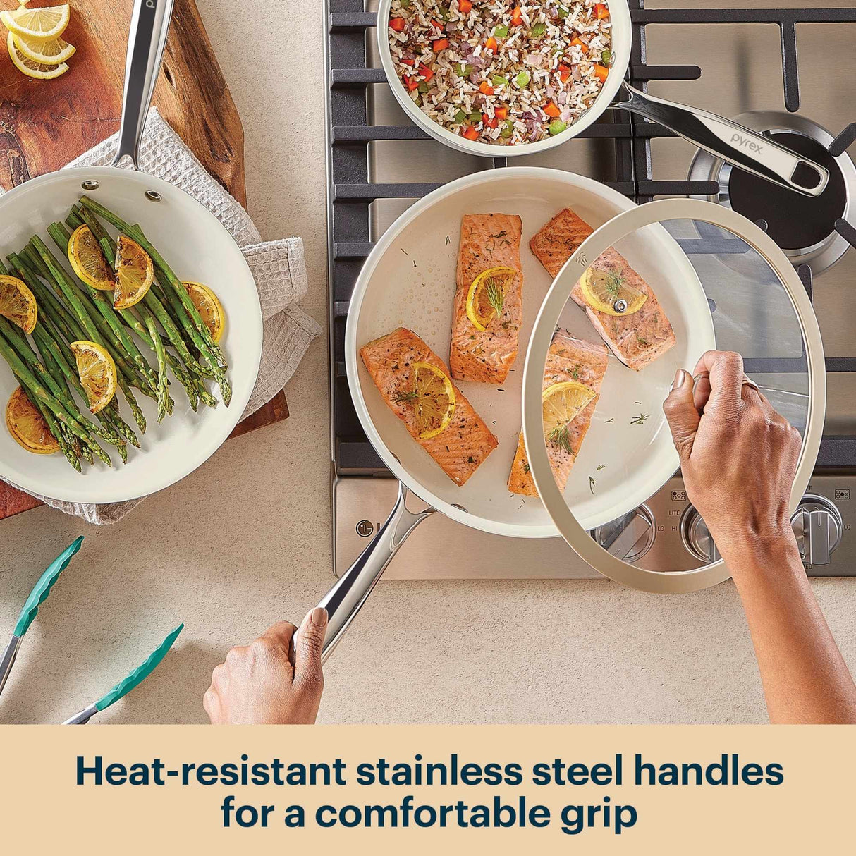 Cooking scene with pots and pans on a stove, featuring heat-resistant stainless steel handles.