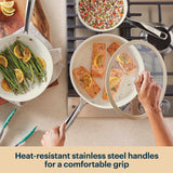 Cooking scene with pots and pans on a stove, featuring heat-resistant stainless steel handles.