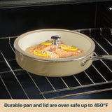 Ceramic cookware with lid containing salmon dish inside an oven.