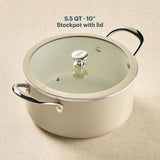 Beige stockpot with lid on a beige background