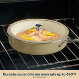 Beige ceramic cookware set with salmon dish inside an oven