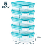 Five clear food storage containers with blue lids stacked on a white background