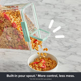 Close-up of a Snapware® food storage canister with an integrated pour spout, pouring cereal into a bowl for easy serving.