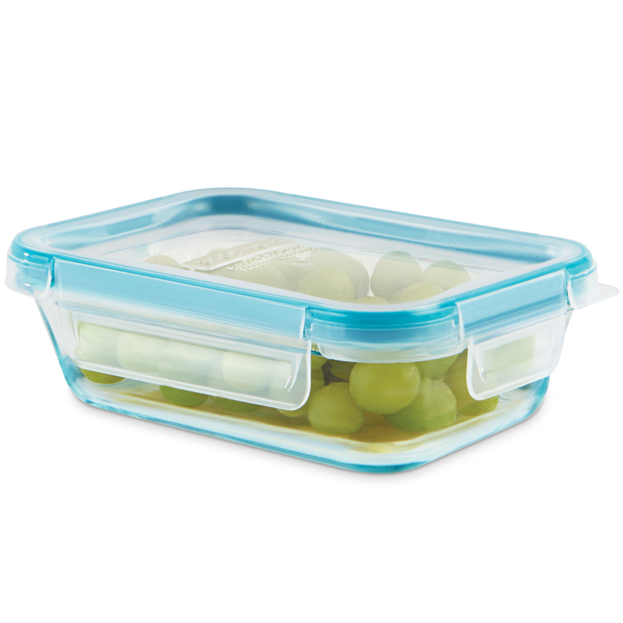 Glass food storage container with blue lid holding green grapes on a white background