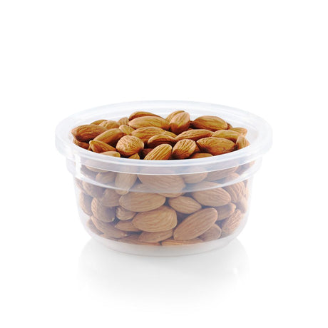 Clear plastic container filled with almonds on a white background