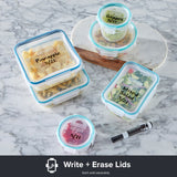 Set of food storage containers with writeable lids on a marble surface