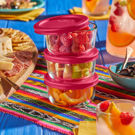 Pyrex glass set, vibrant food on a colorful tablecloth