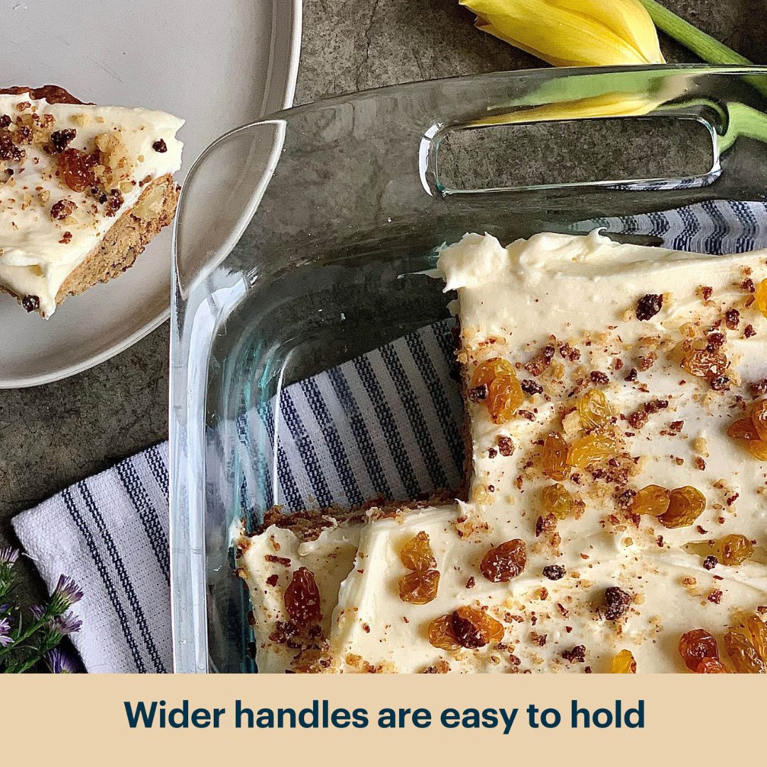Glass baking dish with dessert, slice on plate, and text 'Wider handles are easy to hold'.