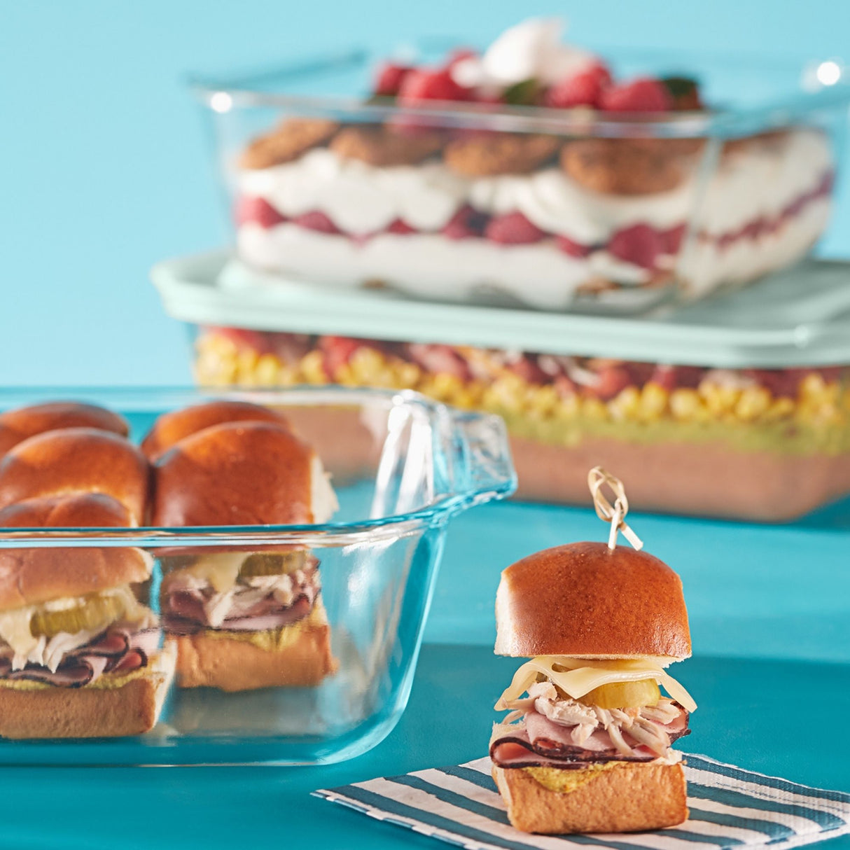 Mini sandwiches on buns with a blue background