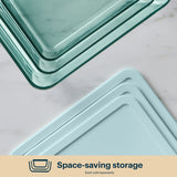 Stackable glass containers and lids designed for space-saving storage.