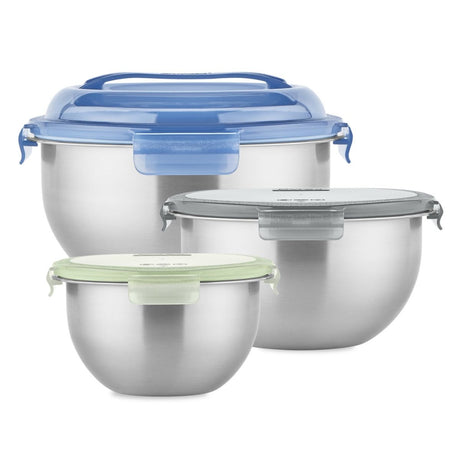 Set of stainless steel food containers with blue and green lids on a white background