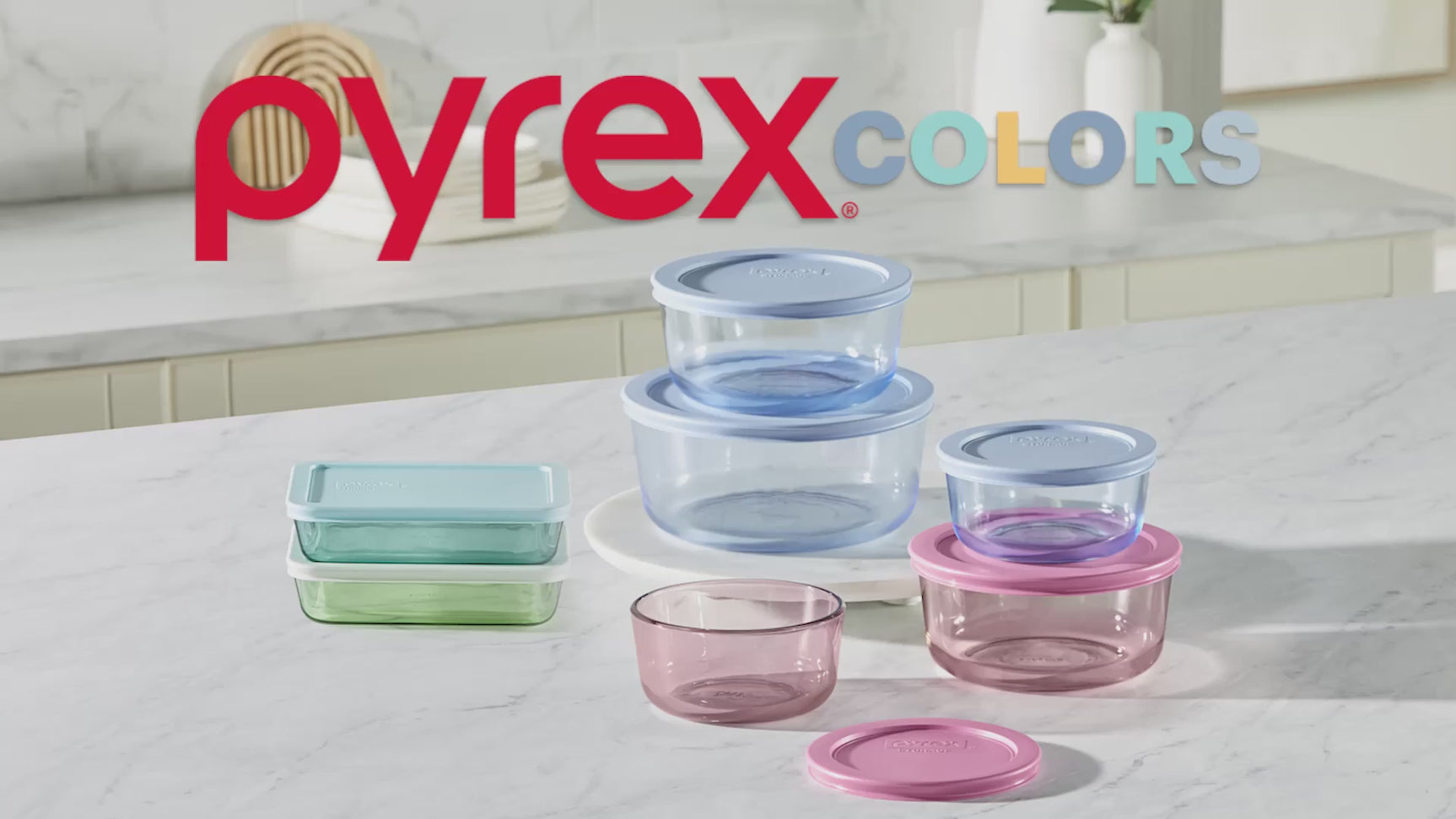 Video thumbnail: Pyrex COLORS glass food storage containers in blue, pink, and green on a kitchen counter.
