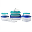 Set of clear food storage containers with blue lids on a white background