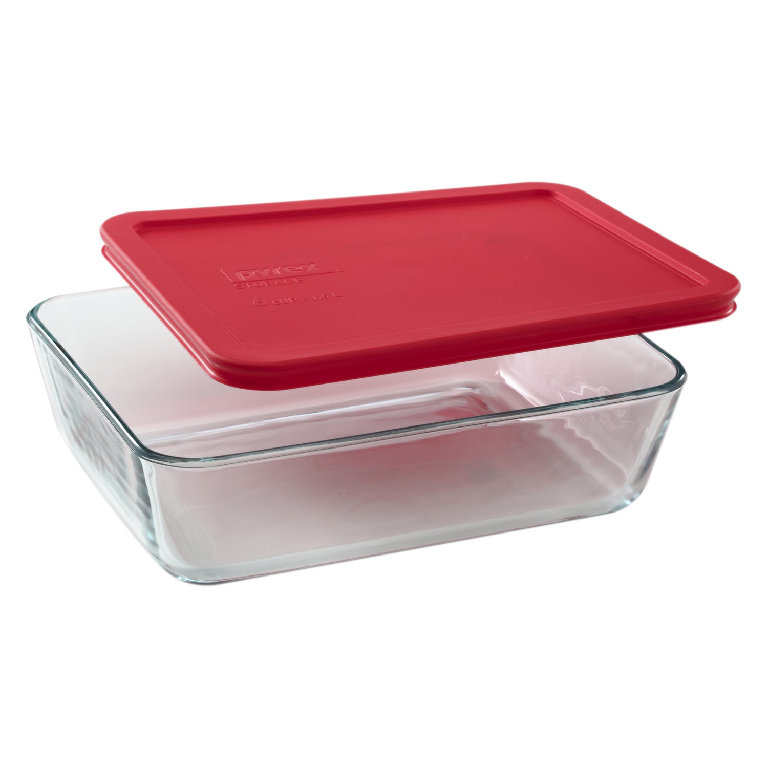 Clear glass food storage container with a red lid on a white background