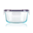 Clear plastic container with a purple lid on a white background